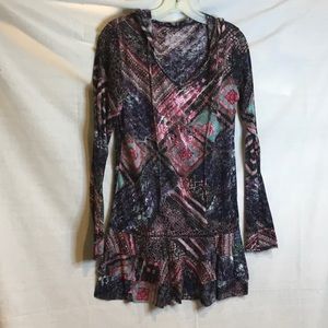 Long tunic with stud embellishments on front and right sleeve